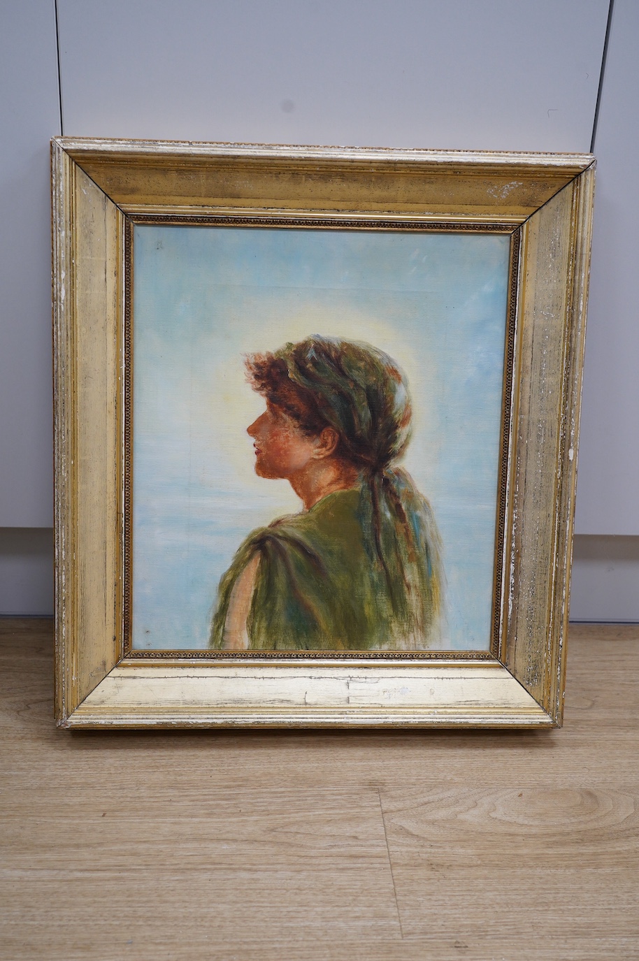 Early 20th century School, oil on canvas, Portrait of a woman wearing a headscarf, 41 x 35.5cm, gilt framed. Condition - fair